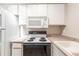 Simple kitchen with microwave and stove top at 5300 E Cherry Creek South Dr # 905, Denver, CO 80246