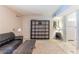 Bright living room, featuring a black leather couch at 5300 E Cherry Creek South Dr # 905, Denver, CO 80246