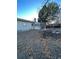 Large backyard with a partially damaged tree at 14697 E Oregon Dr, Aurora, CO 80012