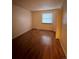 Simple bedroom with wood-look floors and a window at 14697 E Oregon Dr, Aurora, CO 80012