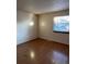 Bright bedroom featuring wood-look floors and ample natural light at 14697 E Oregon Dr, Aurora, CO 80012