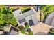 Aerial view of home with solar panels, fenced backyard, mature trees, and proximity to neighborhood amenities at 16673 E Kent Dr, Aurora, CO 80013