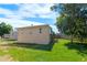 Back exterior of home with a well-maintained yard, providing a serene outdoor setting at 16673 E Kent Dr, Aurora, CO 80013