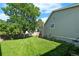 Spacious backyard with lush green lawn and mature trees, perfect for relaxation and outdoor enjoyment at 16673 E Kent Dr, Aurora, CO 80013