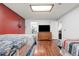 Basement bedroom with hard wood floors, two twin beds, and a TV at 16673 E Kent Dr, Aurora, CO 80013
