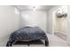 Bedroom with large closet, tile flooring and a full-sized bed with grey bedding at 16673 E Kent Dr, Aurora, CO 80013