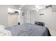 Bedroom with closet, carpet flooring and a full-sized bed with grey bedding at 16673 E Kent Dr, Aurora, CO 80013