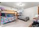 Bright bedroom with a bunk bed and a twin bed, perfect for a ' room or a guest room at 16673 E Kent Dr, Aurora, CO 80013