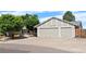 Charming single-Gathering home boasts a three-car garage and a well-maintained front yard at 16673 E Kent Dr, Aurora, CO 80013