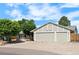 Charming single-Gathering home boasts a three-car garage and a well-maintained front yard at 16673 E Kent Dr, Aurora, CO 80013
