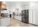 Bright kitchen with granite countertops, stainless steel appliances, and ample cabinet space at 16673 E Kent Dr, Aurora, CO 80013