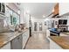 Well-lit kitchen features granite countertops, modern appliances, and an adjacent dining area at 16673 E Kent Dr, Aurora, CO 80013