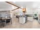 Well-lit kitchen with an open floor plan including a central island and stainless steel appliances at 16673 E Kent Dr, Aurora, CO 80013