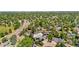 Charming neighborhood view showcasing homes, solar panels, mature trees, and convenient access to roads at 16673 E Kent Dr, Aurora, CO 80013