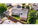 Aerial view of home featuring solar panels, a fenced yard, a patio, and mature landscaping at 16673 E Kent Dr, Aurora, CO 80013