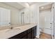 Well-lit bathroom featuring modern vanity with countertop, large mirror, and a separate shower/tub combo at 5918 Red Barn Ave, Mead, CO 80504