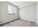 A carpeted bedroom with large window for optimal natural light and views of the exterior at 5918 Red Barn Ave, Mead, CO 80504