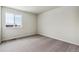 Bright, inviting bedroom featuring neutral carpet, ample natural light, and a serene view from the window at 5918 Red Barn Ave, Mead, CO 80504