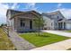 A lovely two-story home with a well-kept lawn, showcasing its inviting curb appeal in a Gathering-friendly neighborhood at 5918 Red Barn Ave, Mead, CO 80504