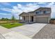 Beautiful two-story home with a spacious driveway and a well-maintained lawn, perfect for suburban living at 5918 Red Barn Ave, Mead, CO 80504