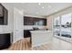 Modern kitchen featuring a large island, pendant lighting, stainless steel appliances, and sleek cabinetry at 5918 Red Barn Ave, Mead, CO 80504