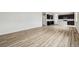 Open-concept living room with sleek hardwood floors and plenty of space for entertaining and relaxation at 5918 Red Barn Ave, Mead, CO 80504
