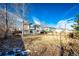 Large backyard, grassy area, and two-story home in background at 168 Peabody St, Castle Rock, CO 80104