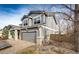 Gray two-story house with a two-car garage and a landscaped yard at 168 Peabody St, Castle Rock, CO 80104