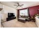 Gathering room with a sectional sofa and a ceiling fan at 168 Peabody St, Castle Rock, CO 80104