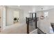 Spacious upper landing with laundry and stairway at 12606 Fisher St, Englewood, CO 80112