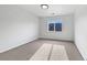 Minimalist bedroom with soft carpet, a bright window, and ample space for personalized décor at 10818 Cimarron St # 307, Firestone, CO 80504