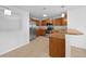 Well-equipped kitchen featuring wood cabinets, stainless steel appliances, and an efficient layout at 10818 Cimarron St # 307, Firestone, CO 80504