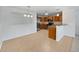 Well-lit kitchen with stainless steel appliances, breakfast bar, and ample counter space at 10818 Cimarron St # 307, Firestone, CO 80504