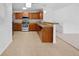 Well-equipped kitchen with stainless steel appliances, tile backsplash, and breakfast bar at 10818 Cimarron St # 307, Firestone, CO 80504