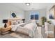 Comfortable main bedroom featuring a cozy rug, a soothing color palette, and ample natural light at 10818 Cimarron St # 307, Firestone, CO 80504