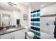 Well-lit bathroom with a vanity, toilet, bathtub and shower combo at 883 Widgeon Cir, Longmont, CO 80503