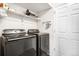Well-organized laundry room featuring modern washer and dryer units, and ample storage space at 883 Widgeon Cir, Longmont, CO 80503