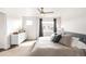 Bright and airy main bedroom featuring large windows and plush carpeting for a cozy retreat at 883 Widgeon Cir, Longmont, CO 80503