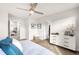 Serene main bedroom with a ceiling fan, walk-in closet, and an en-suite bathroom at 883 Widgeon Cir, Longmont, CO 80503
