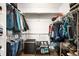 Well-organized walk-in closet with ample hanging space, shelving, and floor storage at 883 Widgeon Cir, Longmont, CO 80503