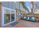 A well-kept wooden back deck featuring outdoor seating and access to the home through a sliding glass door at 3850 Paseo Del Prado # 29, Boulder, CO 80301