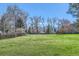 Large backyard featuring a well-kept lawn enclosed by a wooden fence, creating a private outdoor space at 3850 Paseo Del Prado # 29, Boulder, CO 80301