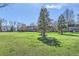 Expansive green backyard offers a serene view of the neighborhood and the nearby mountains at 3850 Paseo Del Prado # 29, Boulder, CO 80301