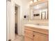 Bright bathroom with a wood vanity, tile flooring, and a walk-in closet at 3850 Paseo Del Prado # 29, Boulder, CO 80301