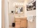 Bright bathroom featuring a wood vanity and wall art at 3850 Paseo Del Prado # 29, Boulder, CO 80301