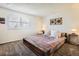 Bright bedroom showcasing a decorative accent wall and a cozy bed with comfortable throw pillows at 3850 Paseo Del Prado # 29, Boulder, CO 80301