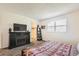 Bedroom featuring a fireplace with a TV, and a walk-in closet at 3850 Paseo Del Prado # 29, Boulder, CO 80301