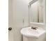 Clean bathroom featuring a vanity, mirror, toilet, shower and an interior door at 1235 S Monaco Pkwy, Denver, CO 80224