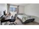 Bedroom featuring a desk and chair, with natural light, and a bed at 1235 S Monaco Pkwy, Denver, CO 80224