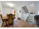 Dining area with staircase and view of kitchen at 1235 S Monaco Pkwy, Denver, CO 80224